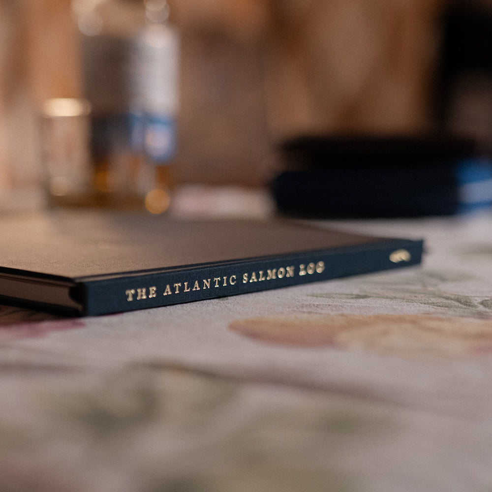 A close up image of the Atlantic Salmon Log on a table in an old cottage.