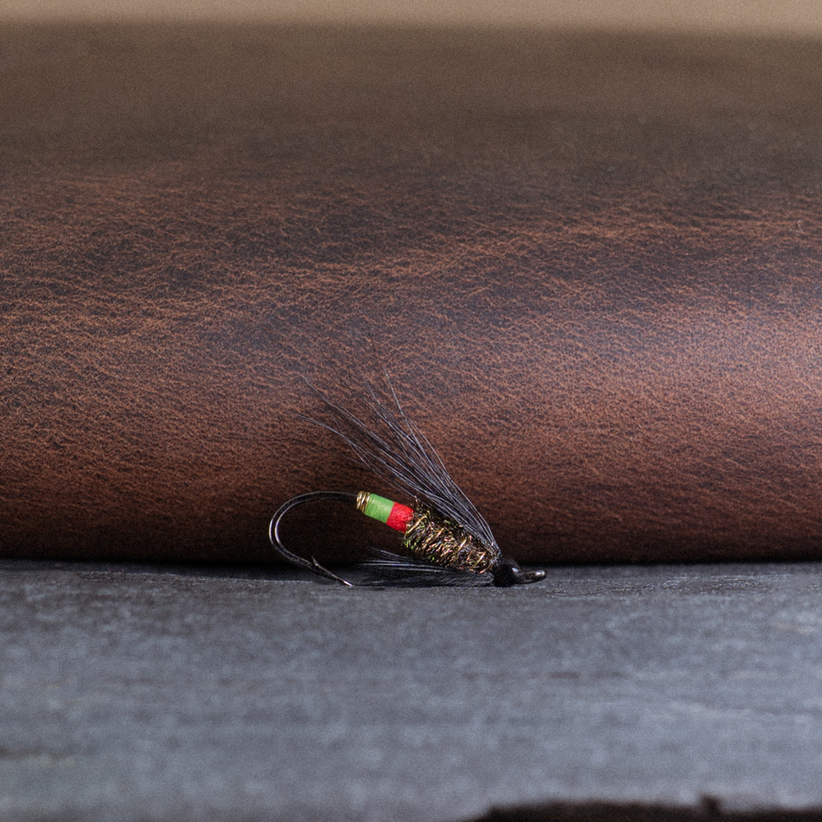 An Atlantic salmon fly named the Undertaker that is popular in Eastern Canada for Atlantic salmon and steelhead fly fishing, tied here on a single hook (#10).
