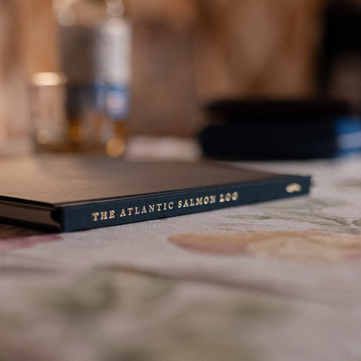 A close up image of the Atlantic Salmon Log on a table in an old cottage.