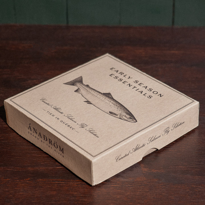 Ánadröm Early Season Essentials closed fly box, angled view, with Atlantic salmon illustration, tied in Québec.